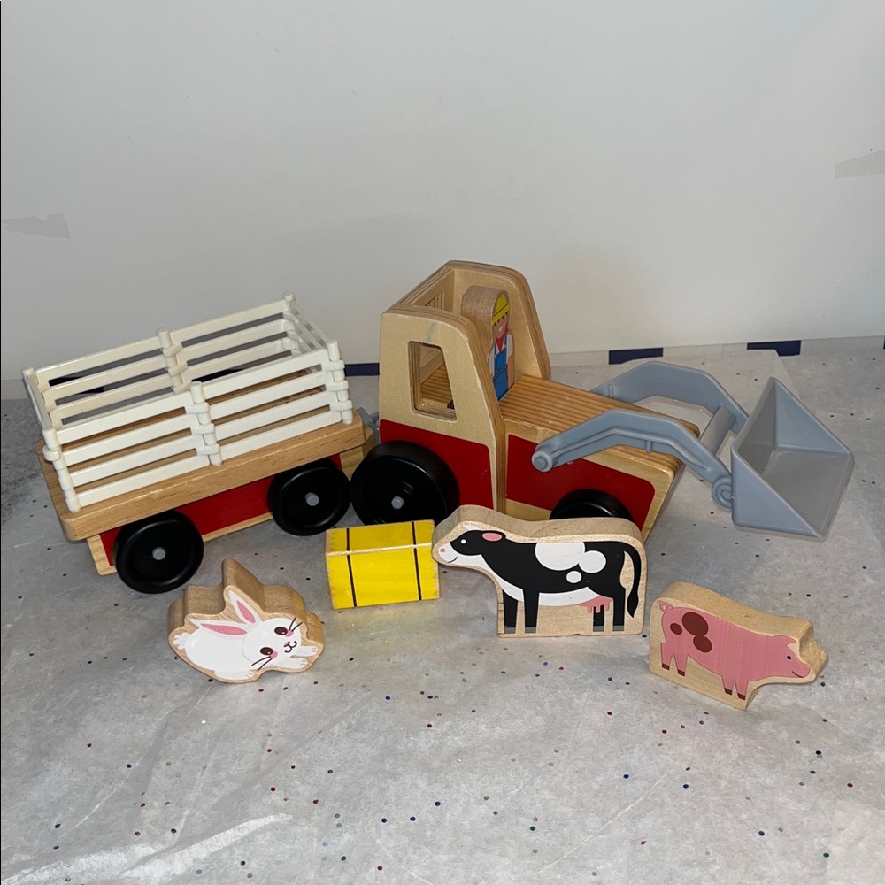 Melissa and Doug… wooden play set, wagon will unhitch from tractor. - Picture 2 of 3